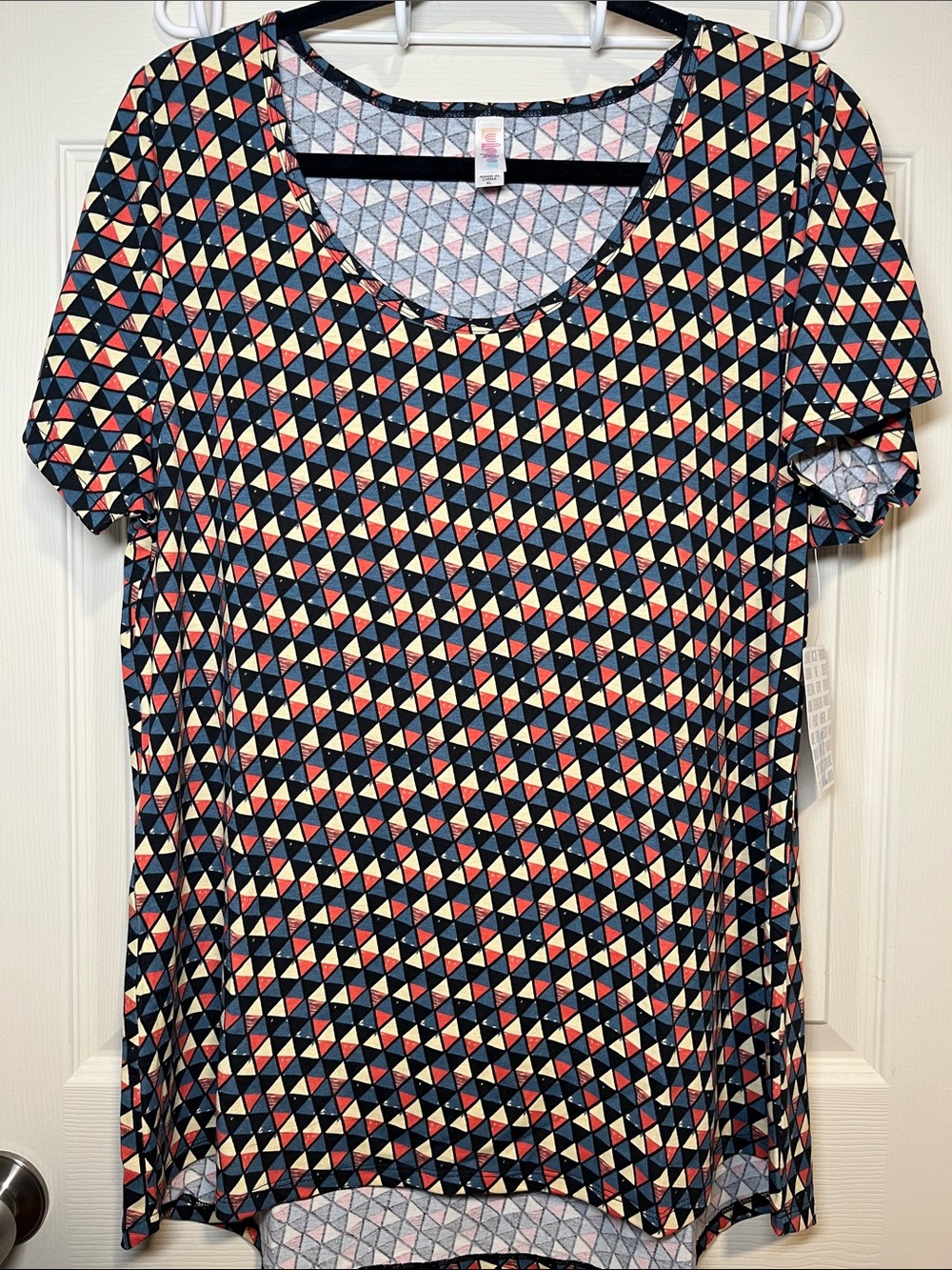 LuLaRoe Navy Geometric Short Sleeve Top with Coral & Cream Triangles